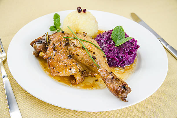 istock Duck leg, potato dumplings and gravy 488635888