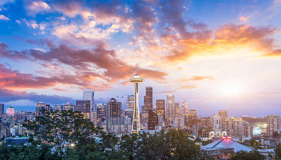 Seattle in the early evening, Washington, USA - silhouette of a city with a volcano in the background at sunset