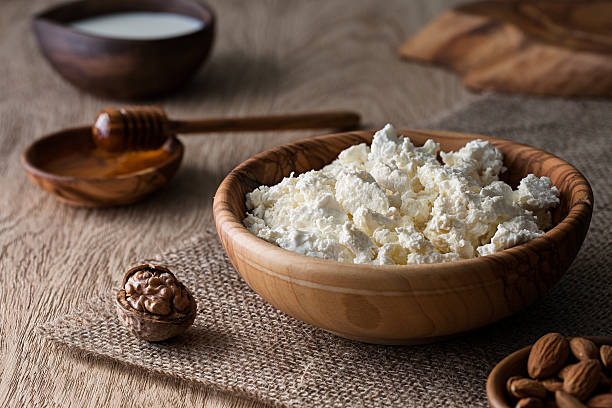 istock Cottage cheese in a wooden bowl 488636844