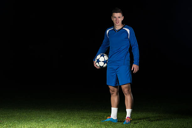 istock Portrait Of A Soccer Player On Black Background 488638280