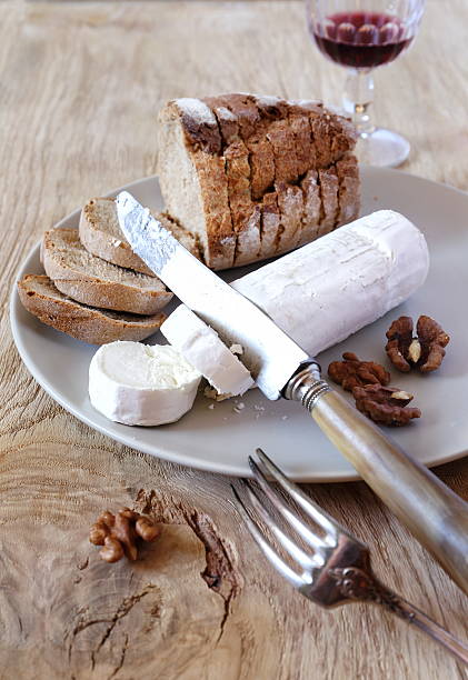 istock French lunch: goat cheese, bread and wineglass 488638740
