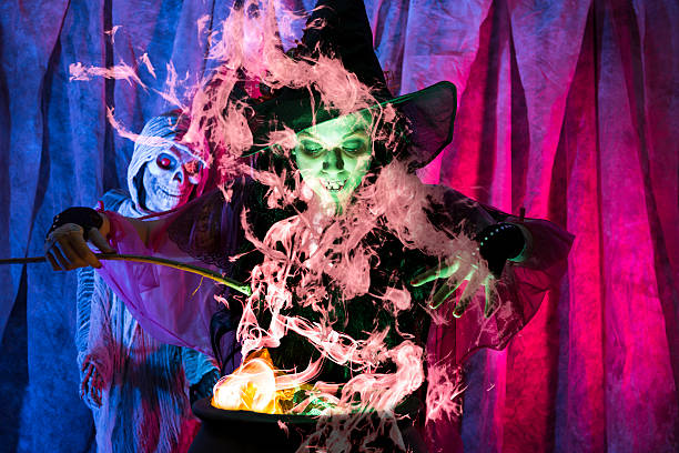 istock Halloween:  Witch cooking her brew for special guests. Zombie. Cauldron. 488639380