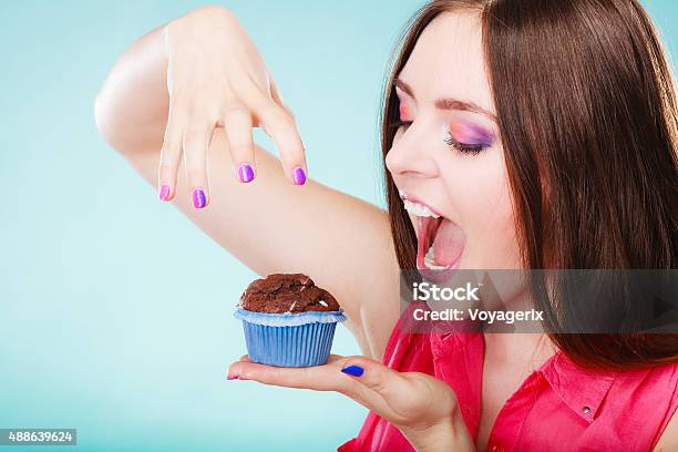 Smiling Woman Holds Chocolate Cake In Hand Stock Photo - Download Image Now - 2015, Addict, Addiction