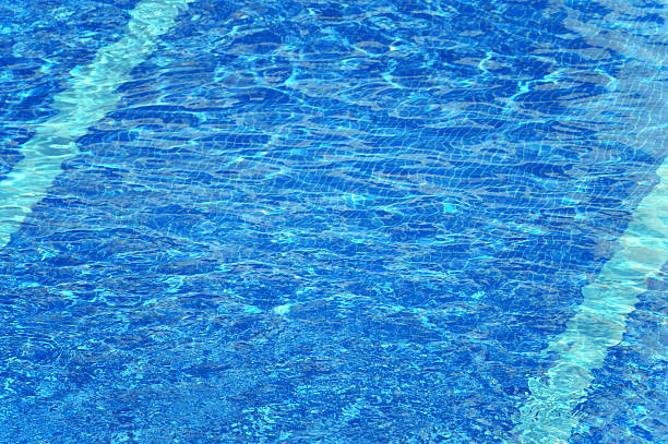istock Clear blue water ripples in a swimming pool 488640714