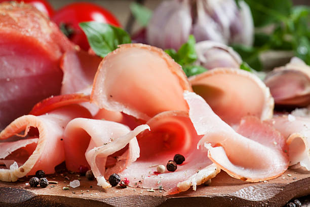 istock Slices of smoked ham on a cutting board 488640972