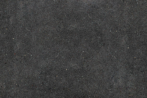 Real asphalt texture background. Coloured dark black asphalt pattern. stock photo