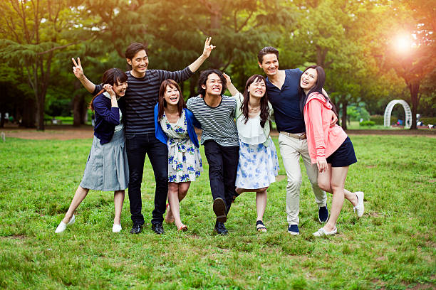 istock Young people walking in park in Tokyo. 488649480