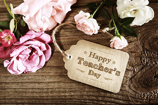 istock Happy Teachers Day message card with small roses 488650364