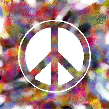 Peace symbol created from colorful brush strokes on computer.