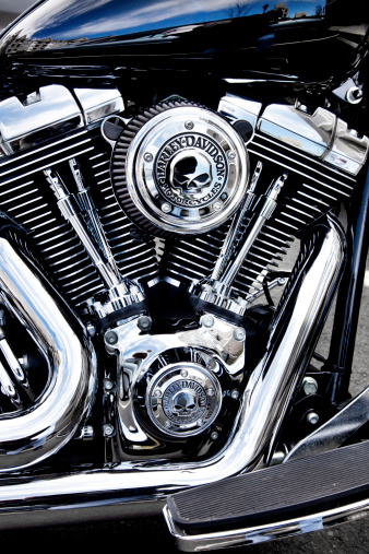 Bergen County, New Jersey, USA - May 4, 2014: Harley Davidson motorcycle engine with custom Harley skull medallions. Harley Davidson motorcycle engines are the model copied by other top motorcycle manufactures worldwide.