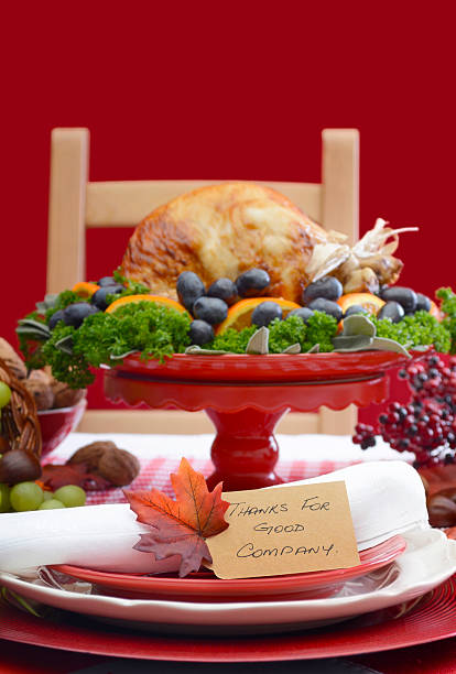 istock Thanksgiving Table Setting with Roast Turkey on Red White Backgr 488651556