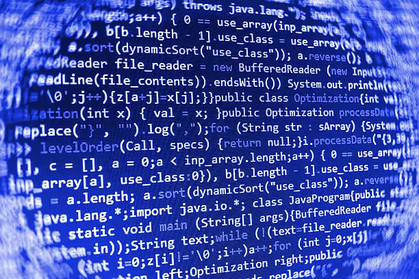 Photo of Software developer programming code on computer