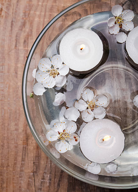 istock Candles and flowers in a bowl 488651621