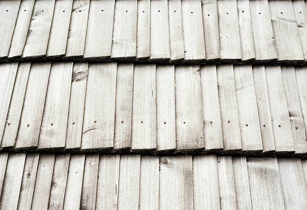 istock Old wooden shingled roof texture 488652283