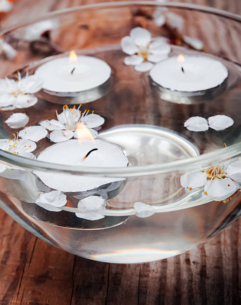 istock Candles and flowers in a bowl 488652411