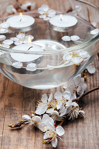 istock Candles and flowers in a bowl 488652413