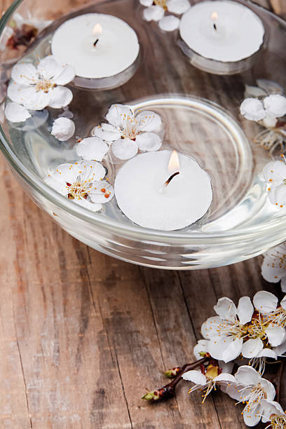 istock Candles and flowers in a bowl 488652415