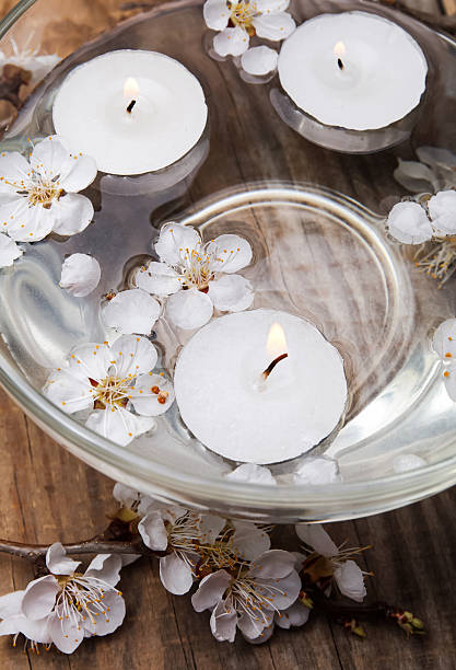 istock Candles and flowers in a bowl 488652419