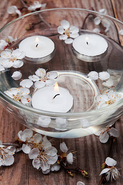istock Candles and flowers in a bowl 488652421