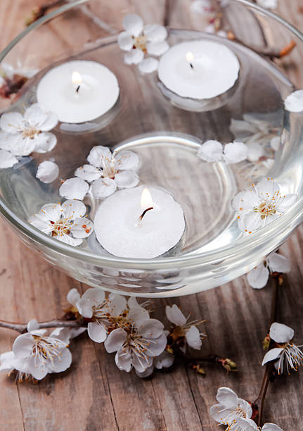 istock Candles and flowers in a bowl 488652423