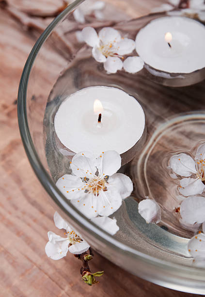 istock Candles and flowers in a bowl 488652427
