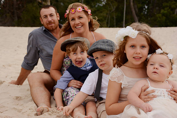 istock Family sitting at the beach 488654350