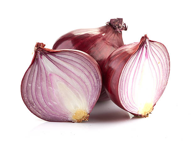 istock Red sliced onion isolated on white background 488654731