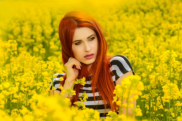 istock woman in flower field 488655707