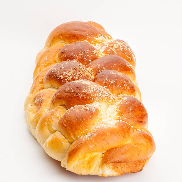 Light braided challah isolated on white background Light braided challah isolated on white background judiaca stock pictures, royalty-free photos & images