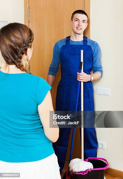Girl Meeting Handsome Cleaner Stock Photo - Download Image Now - Adult, Adults Only, Blue-collar Worker