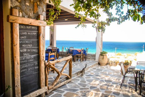 A Taverna in Ios, Greece with the chalk menu-board outside