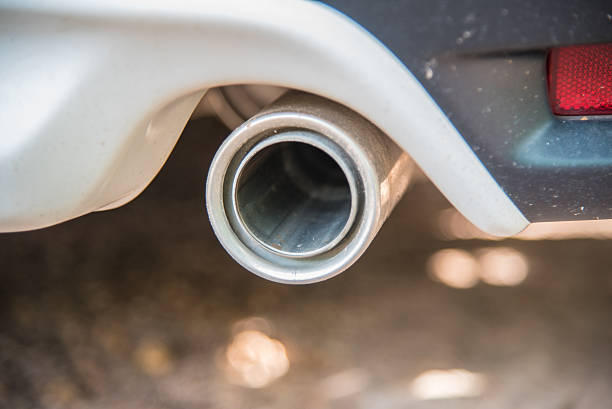 istock exhaust pipe of a white car close up 488659638