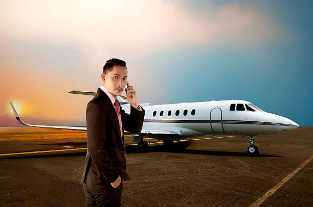 istock Business man calling by phone when walking to the plane 488659718