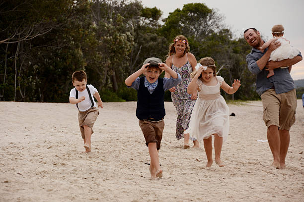 Family running along beach