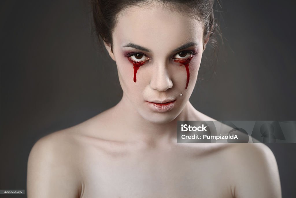 cry Portrait of a female vampire over black background Blood Stock Photo