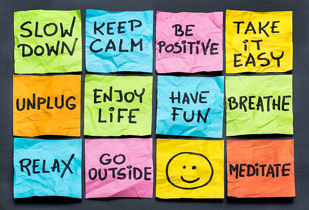 slow down and relax slow down, relax, take it easy, keep calm and other motivational lifestyle reminders on colorful sticky notes smiley face postit stock pictures, royalty-free photos & images