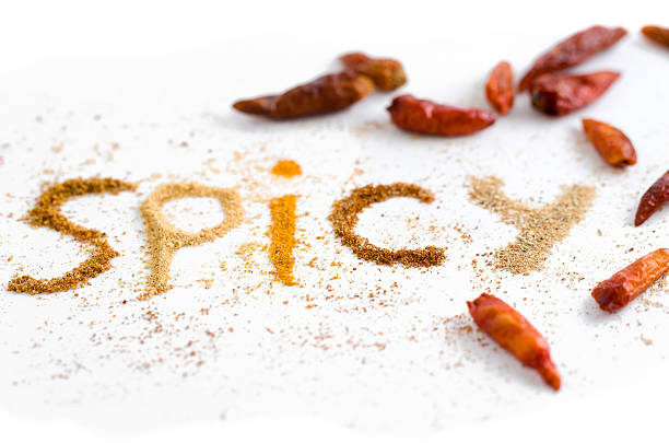 'Spicy' Word Spelled with spices and red chili peppers stock photo