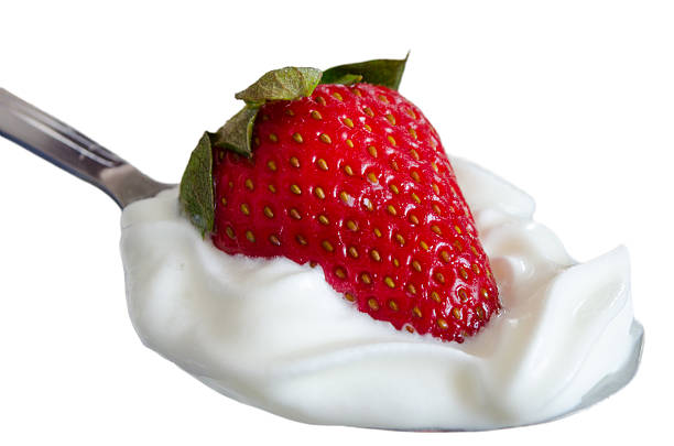 istock Strawberry with cream dessert on spoon 488663915