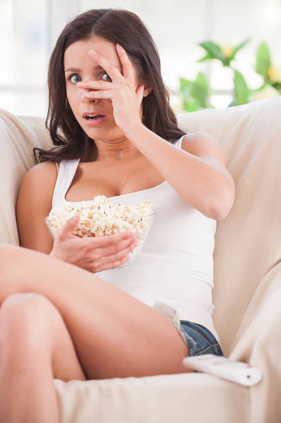 istock Watching a scary movie. 488665319