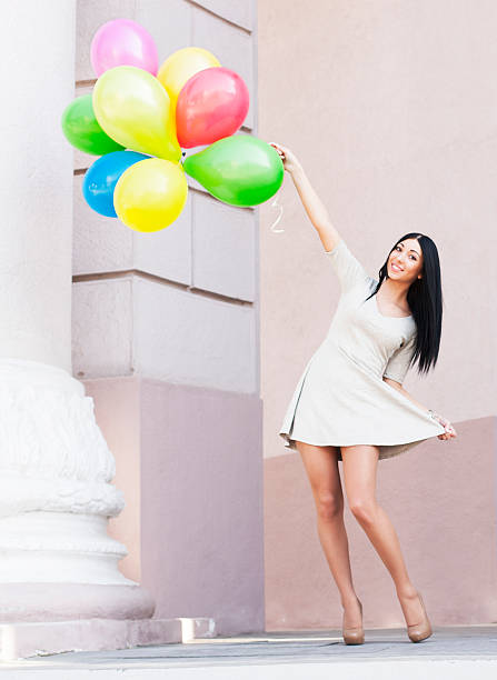 istock Woman with balloons - Stock Image 488665625
