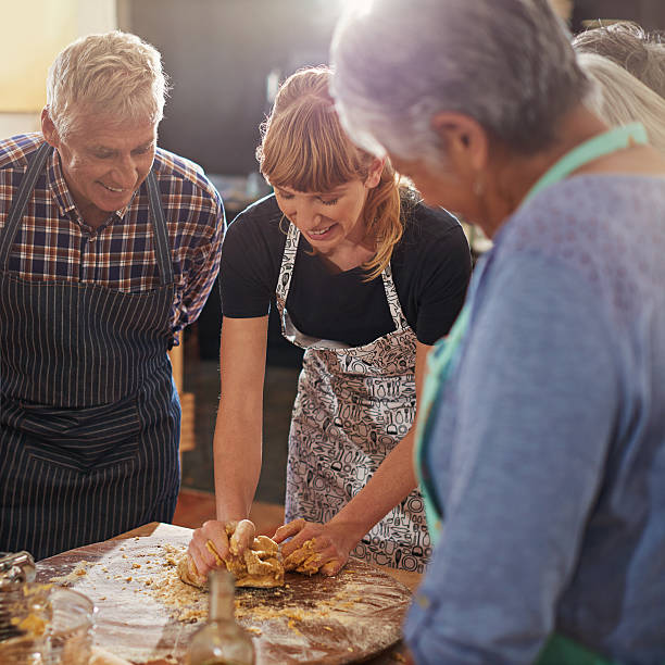istock Showing them how to make the perfect dough 488666386