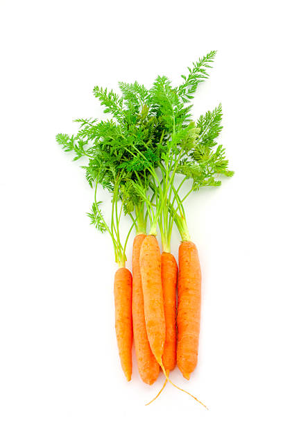 istock Fresh organic carrots on white background 488666393