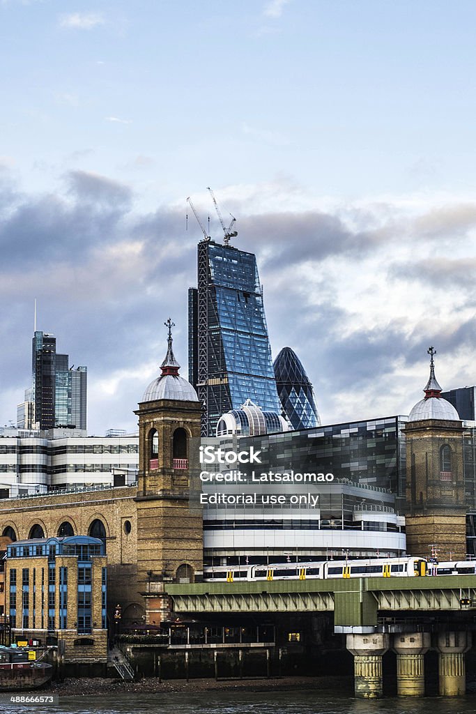 London Thames view London, United Kingdom - October 4, 2013: View of the Thames river in the southwark bank side. A dramatic cloudy sky can be appreciated as well as the Cannon Street Railway. Architecture Stock Photo