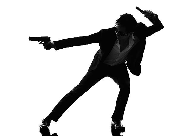 istock asian gunman killer silhouette 488667141