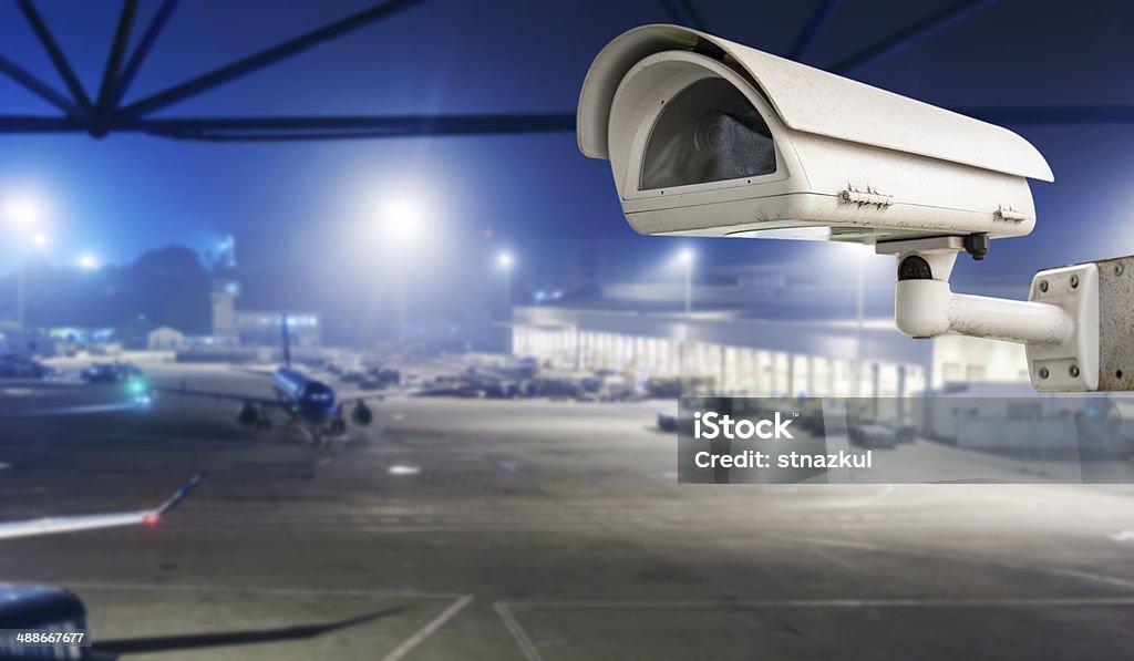 CCTV camera or surveillance operating in air port run way Airport Stock Photo