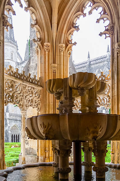 Fountain in the Royal Cloister of the Batalha Monastery Fountain in the Royal Cloister of the Batalha Monastery. A masterpiece of the Gothic and Manueline art. Portugal. UNESCO World Heritage Site. batalha abbey photos stock pictures, royalty-free photos & images