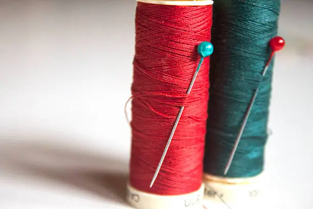 Red and green thread in a row