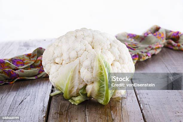 Single Cauliflower On Wooden Background Stock Photo - Download Image Now - Agriculture, Antioxidant, Backgrounds