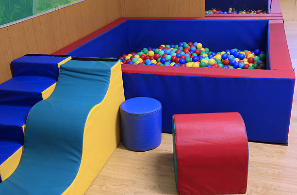 istock gym with exercise equipment and a container with balls 488675166