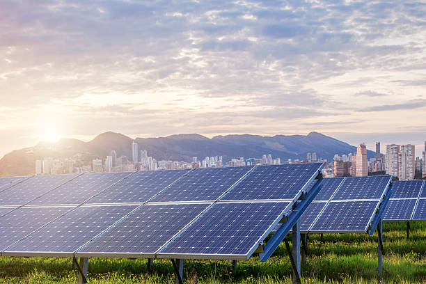 istock Solar panels with city on background 488676790